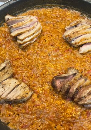 A picture of Paella with Secreto Pork and Rice.