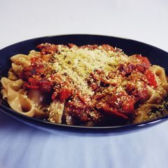 Pasta with tomato sauce and vegan parmesan A picture of Pasta with tomato sauce and vegan parmesan.