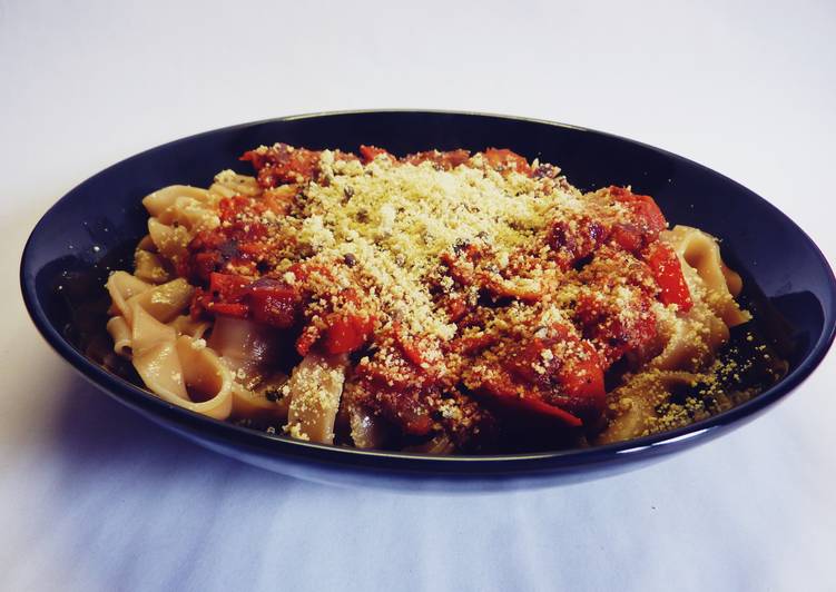 Pasta with tomato sauce and vegan parmesan