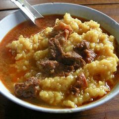 A picture of Rice and stewed  Beef.