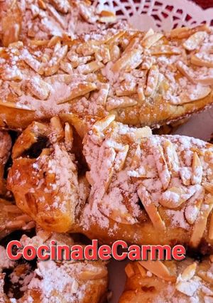 Una foto de Cañas de hojaldre rellenas de turrón de chocolate y mermelada de naranja