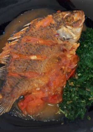 A picture of Wet fried Tilapia with steamed kales.