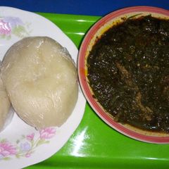A picture of Afang soup with fufu.