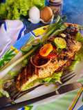 Tomato herbs shrimp stuffed grilled bhetki with lemon butter sauce