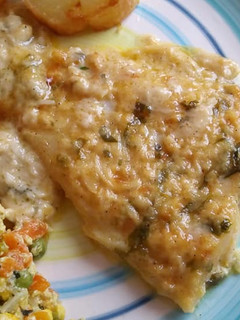 Una foto de Filetes de panga al horno en salsa de queso y crema