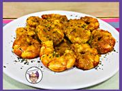 Una foto de colas de rape en salsa
