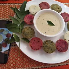 A picture of Multi coloured idli.