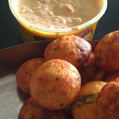 A picture of Vegetable appam with coconut chutney.
