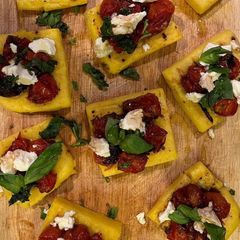 A picture of Grilled Polenta, Goat Cheese & Caramelised Cherry Tomatoes.