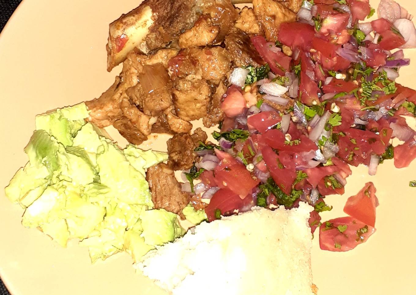 Fried pork/ugali/kachumbari/avocado
