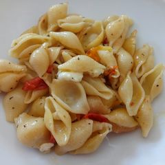 A picture of Pasta shells with roasted rainbow tomatoes.
