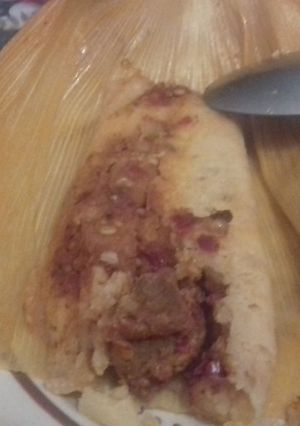 Una foto de Tamal de picadillo de cerveza y chile rojo las correa