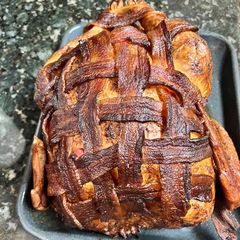 A picture of Bacon wrapped smoked Turkey.