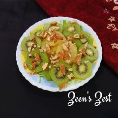 A picture of Green and Sun Gold Kiwis Salad with toasted Almonds.