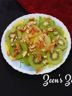 A picture of Green and Sun Gold Kiwis Salad with toasted Almonds.
