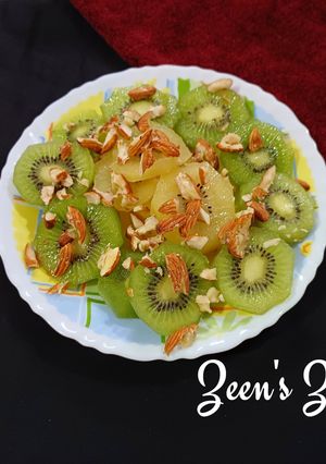 A picture of Green and Sun Gold Kiwis Salad with toasted Almonds.