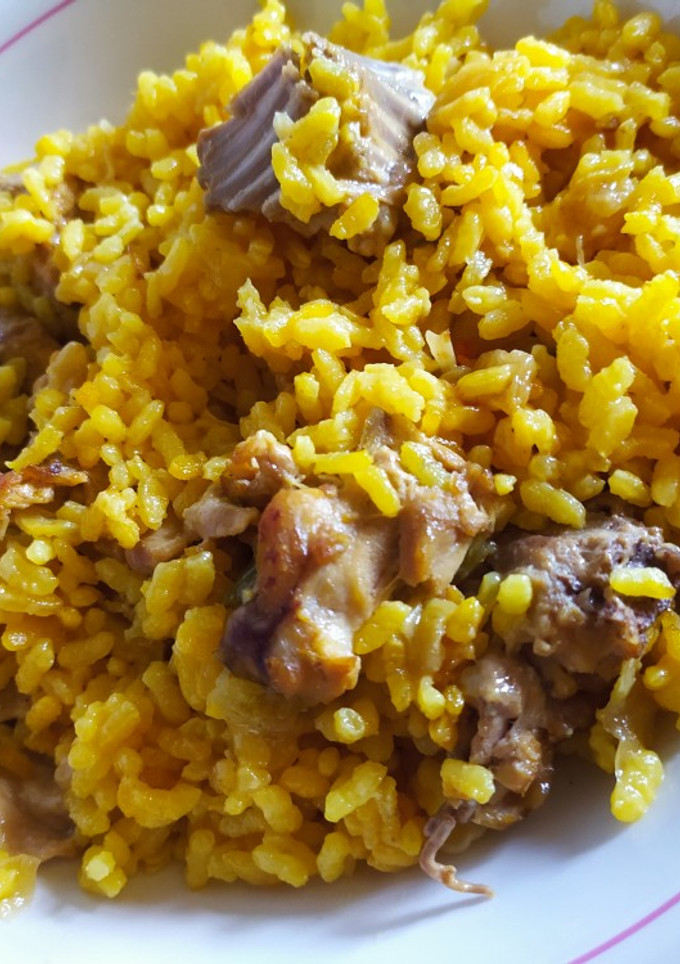 Una foto de Arroz con conejo rico rico
