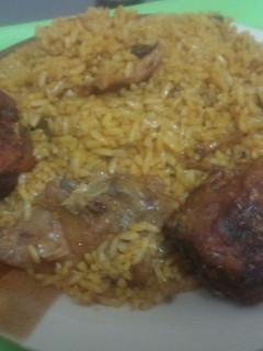 A picture of Native Jollof Rice with Panla Fish.