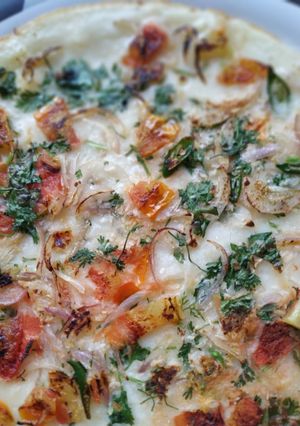 A picture of Tomato Onion Uttapam.