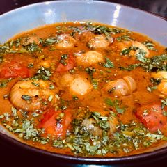 A picture of Baby onions in tomato gravy.