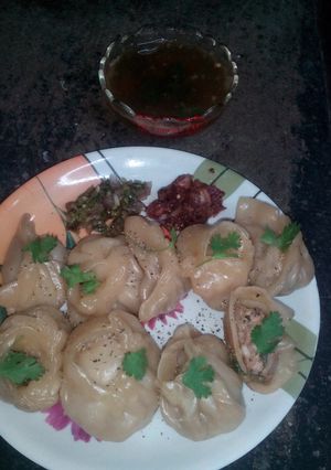 A picture of North eastern hot momos with tangy chutney.