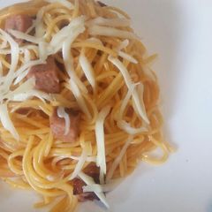 A picture of Sausage spaghetti with cheese.