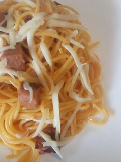 A picture of Sausage spaghetti with cheese.
