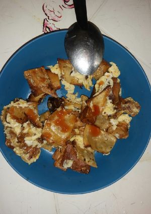 Una foto de Tortilla dorada con huevo y catsup