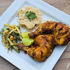 A picture of Spicy baked chicken quarters.