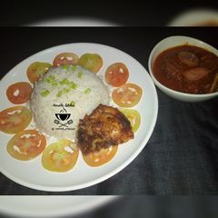 A picture of White rice and stew.