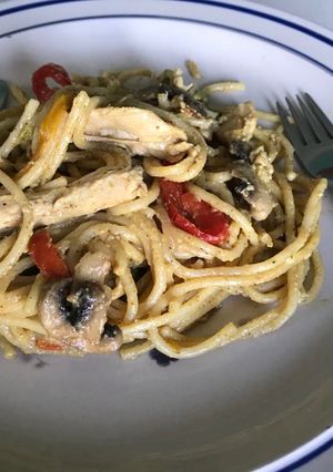 A picture of Spaghetti and chicken strips.
