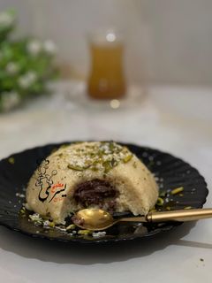 صورة لوصفة حلى السميد وجوز الهند بالشوكلاتة 😋