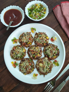 A picture of Mini Corn Pizza (Pizza With Corn Base).