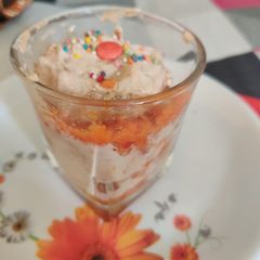 A picture of Carrot halwa dessert with icecream.