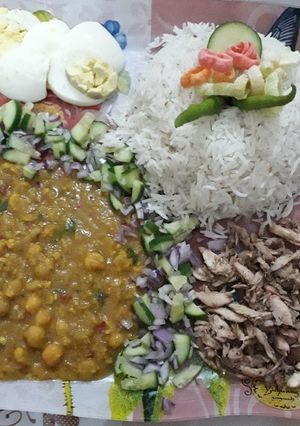 A picture of White chaney with rice egg & shredded chicken Platter.