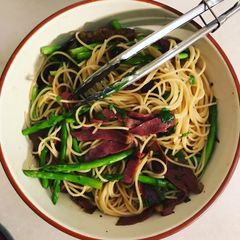 A picture of Beef bacon & asparagus carbonara.