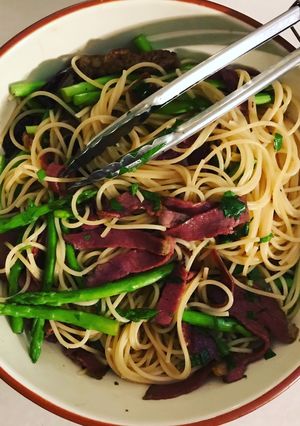 A picture of Beef bacon & asparagus carbonara.
