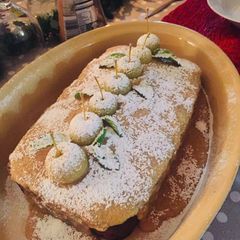 A picture of Apple Cake with Chocolate and Caramel Sauce.