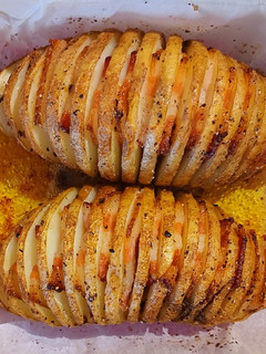 A picture of Hasselback potatoes with bacon.