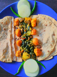 A picture of Palong shak ghonto or Spinach mixed vegetable Curry.