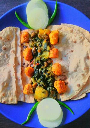 A picture of Palong shak ghonto or Spinach mixed vegetable Curry.