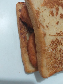 A picture of Beans cake in French toast bread.