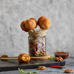 A picture of Crispy cheesy walnut lollipops.