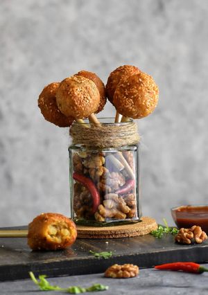 A picture of Crispy cheesy walnut lollipops.