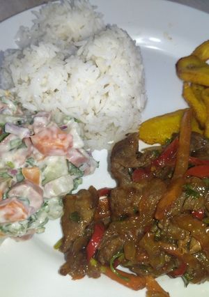 A picture of Beef Stir-Fry with Russian Salad.