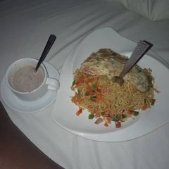 Indomie and egg wit hot tea 😉 A picture of Indomie and egg wit hot tea 😉.