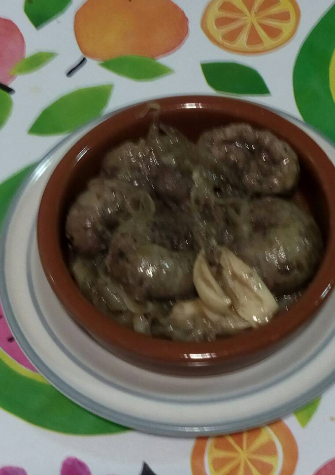 Una foto de Riñones encebollados al oporto