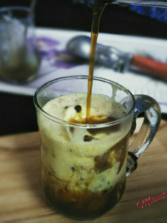 A picture of Affogato coffee dessert with caramel sauce.