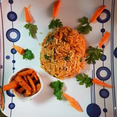 A picture of Schezwan carrot rice with carrot sabzi.