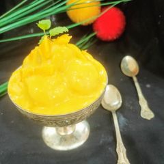A picture of Mango dessert with small rasgulla.
